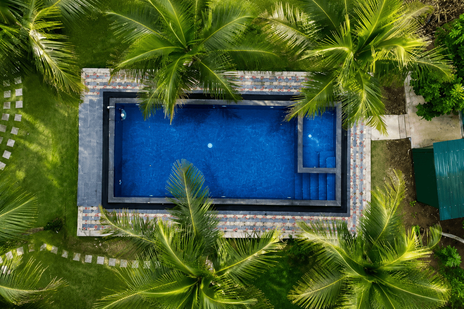 Outdoor swimming pool with garden view at Chill Hutz, Batticaloa